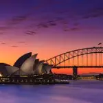 Picture of Sydney Harbour Bridge at sunset - our removalists Gold Coast to Sydney can take you there!